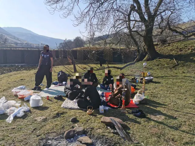 Group smoking shisha pipes