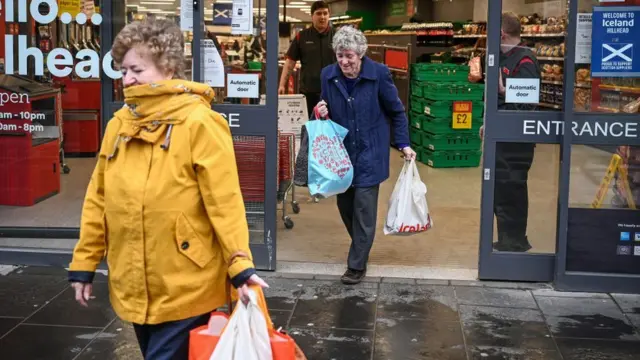 elderly people leaving shop