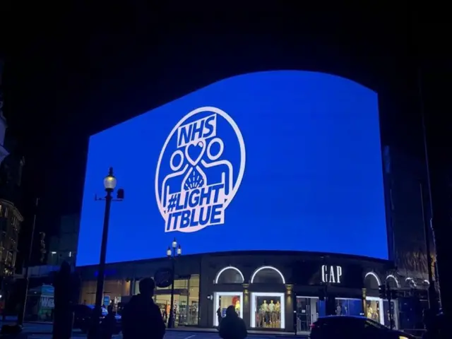 Piccadilly Circus lit up in blue