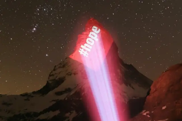 The word hope projected onto the Matterhorn