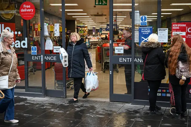 Shoppers outside a supermarket