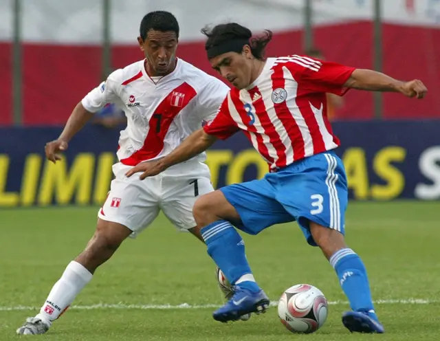 Peru's Nolberto Solano (L) vies for the ball with Paraguay"s Claudio Morel (R) during their their FIFA World Cup South Africa-2010 qualifier football match at the Defensores del Chaco stadium in Asuncion in October 2008.