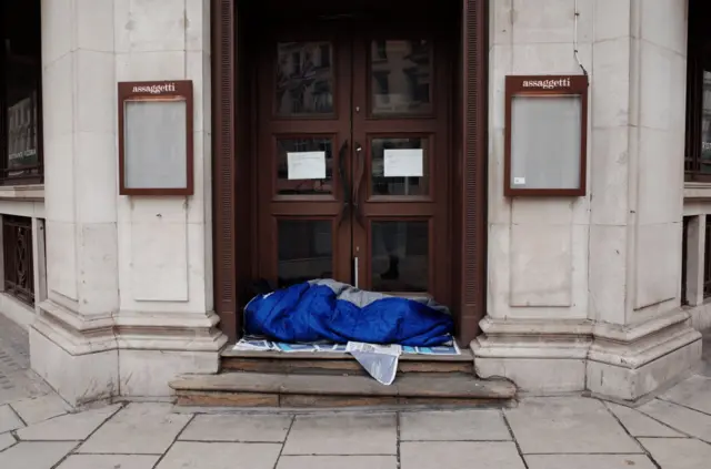 A homeless man sleeping in central London