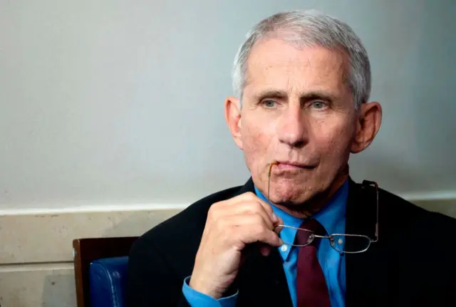 Dr Anthony Fauci looks on as US President Donald Trump speaks during the daily briefing on the novel coronavirus on 27 March