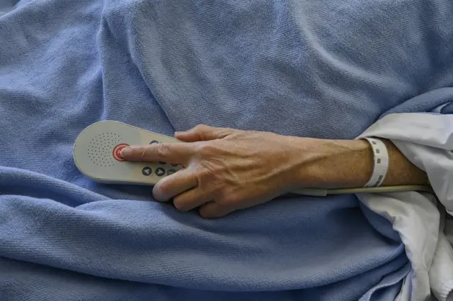 Hospital patient with TV remote control