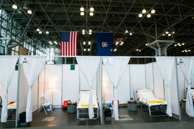 Hospital bed booths are set up at the Jacob K Javits Convention Center