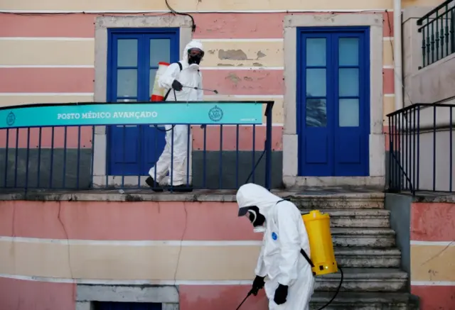 Municipal workers disinfect streets at downtown Cascais, to stop the spread of coronavirus disease Portugal  28 March, 2020