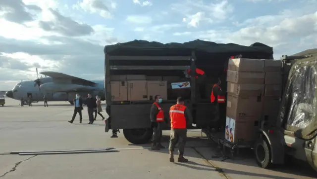 A picture of medical aid being unloaded in Madrid