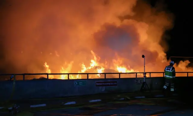 Orange flames rising from the waste