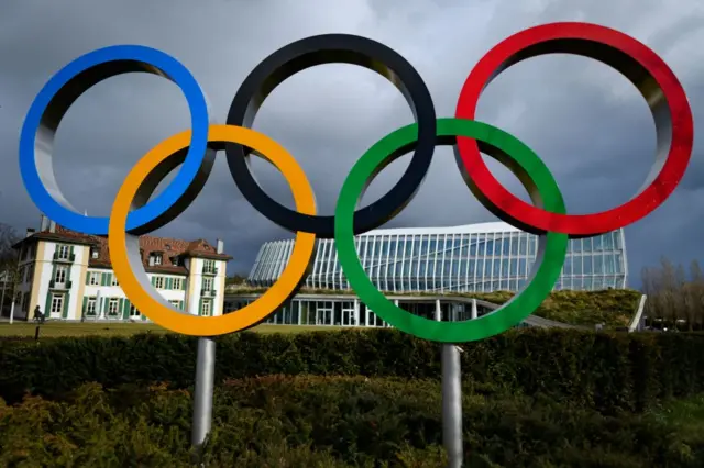 A picture taken on February 26, 2020 shows the Olympics rings next to the IOC headquarters in Lausanne.
