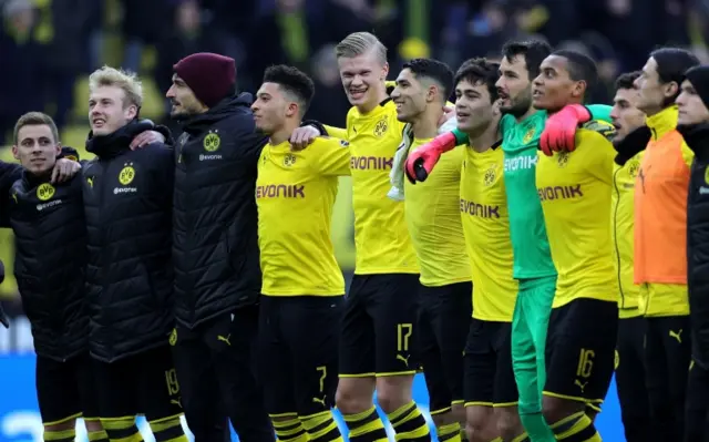 Borussia Dortmund team members celebrate after winning a match against SC Freiburg in Dortmund, Germany, 29 February 2020