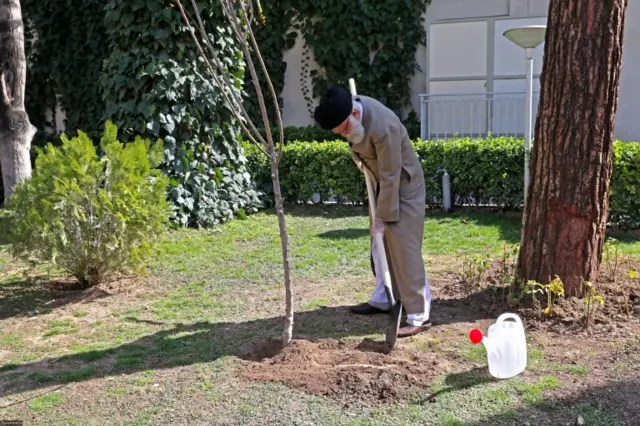 Iran's Supreme Leader Ayatollah Ali Khamenei planting a tree