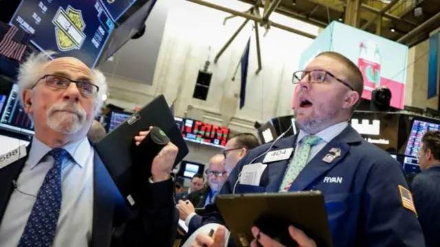 Traders react to stock market volatility amid coronavirus spread