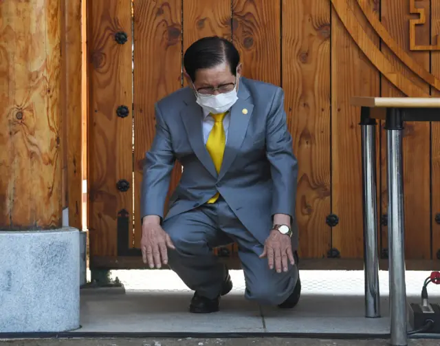 Lee Man-hee, leader of the Shincheonji Church of Jesus, bows during a press conference