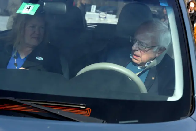 Sanders fastens his seat belt after casting his vote in Vermont