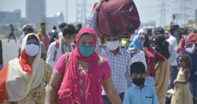 Indian migrant workers walking back home