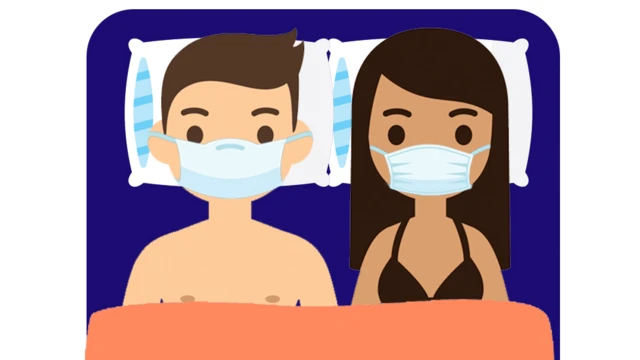 Two people in bed wearing coronavirus masks