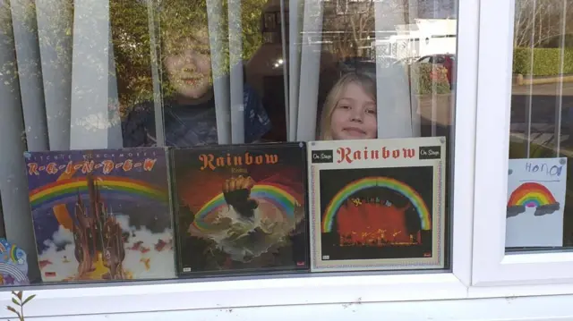 Rainbow albums in a window