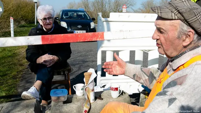 Octogenarians Inga Rasmussen and Karsten Tuchsen Hansen meet on the closed Danish-German border