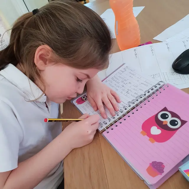 Girl writing a letter