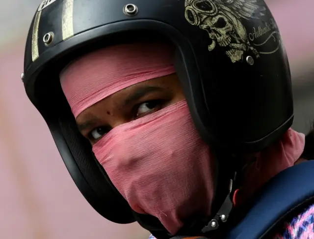 A man wears a protective mask as a precaution against the coronavirus outbreak, in Bangalore, India.