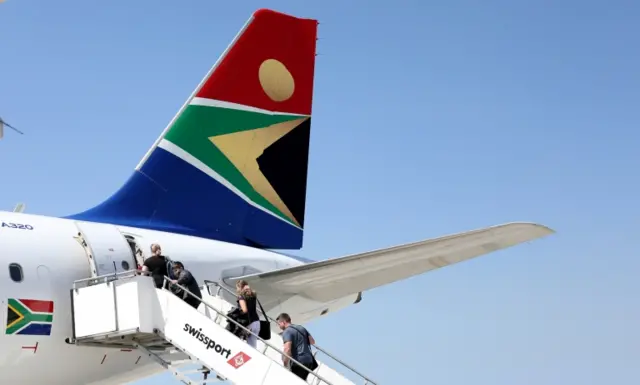 Passengers board a South African Airways plane