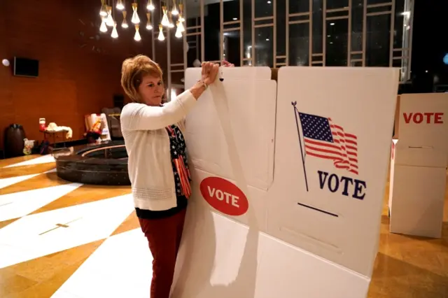 A poll worker at a voting booth in Oklahoma