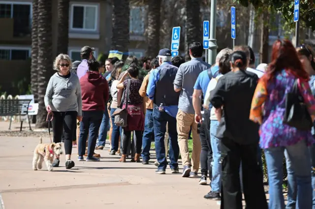 Voters line up outside a library in Burbank, California