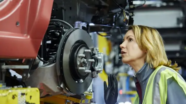 Worker in a car factory