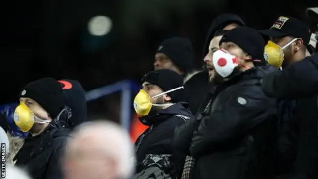 Fans don protective masks at Wednesday's Leicester versus Birmingham FA Cup match