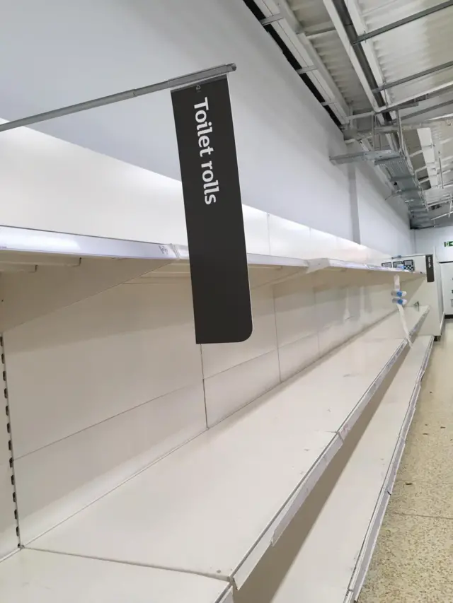 Empty toilet rolls shelves at Sainsbury's store in Beaconsfield