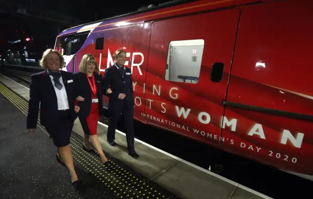 Women and Flying Scotswoman Loco logo