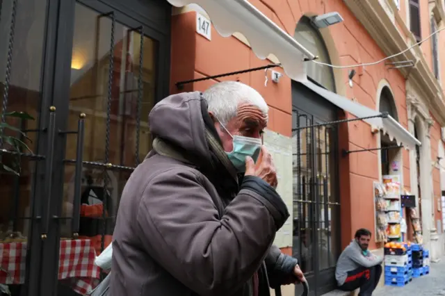 An elderly man wears a mask in Rome, Italy. Photo: 6 March 2020