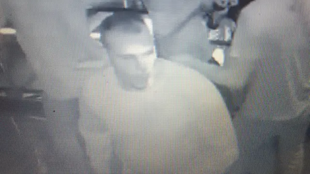 A CCTV image of a man