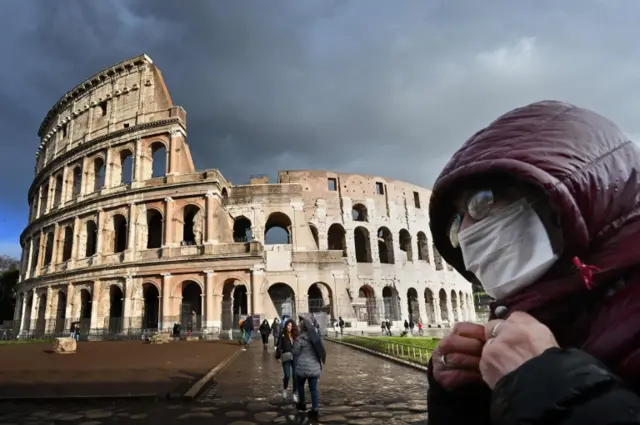 A man wearing a protective mask in Rome