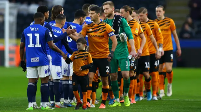 Hull City and Birmingham City players shake hands