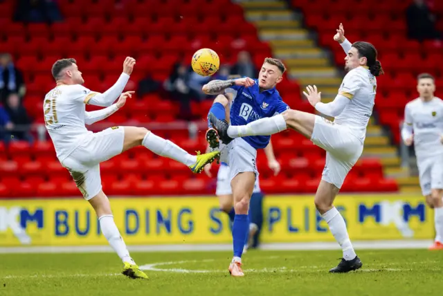 Callum Hendry competes with Livingston's Jack McMillan and Ciaron Brown