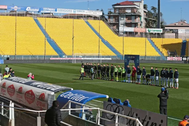 Parma and Spal players line up before the Italian Serie A football match