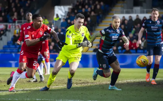 Alfredo Morelos is beaten to the ball by County goalkeeper Ross Laidlaw