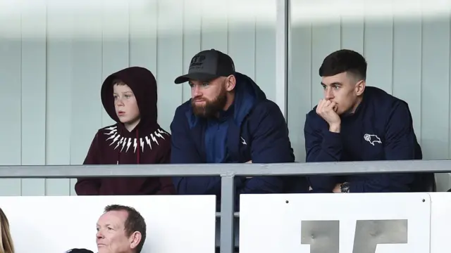 Wayne Rooney watches from the stands