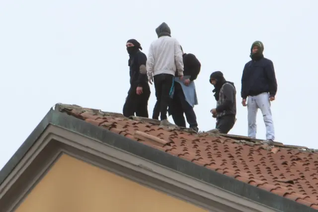 Detainees protest on the roofs of the San Vittore prison in Milan, northern Italy