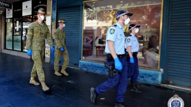 Police and army officers patrolling the streets of Sydney