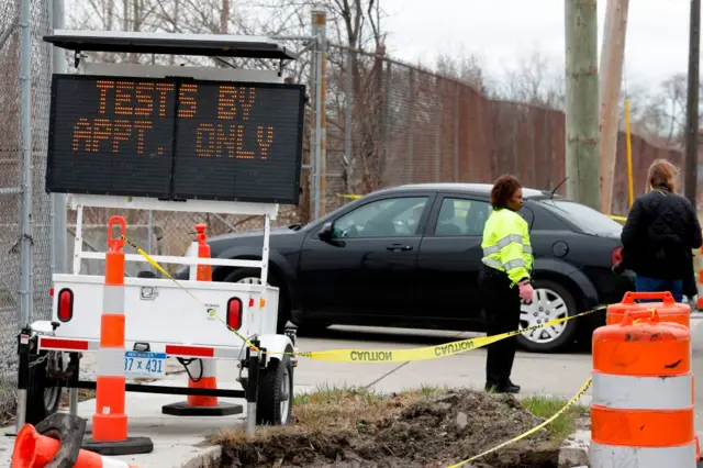 Drive-through testing takes place at the former site of the Michigan state fairgrounds in Detroit