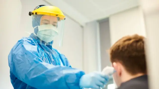 Care worker in protective gear