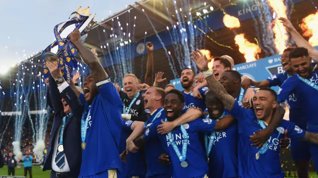 Captain Wes Morgan and manager Claudio Ranieri of Leicester City lift the Premier League Trophy