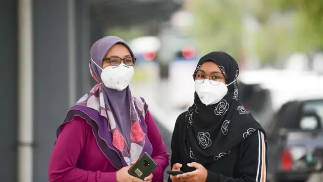 Malaysian women wear face mask while waiting for a public transportation at taxi station amid coronavirus outbreak at Kuala Lumpur on 26th January 2020.