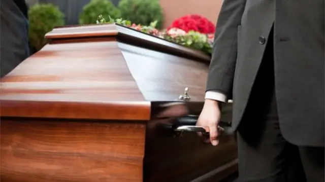 Pallbearers with a coffin