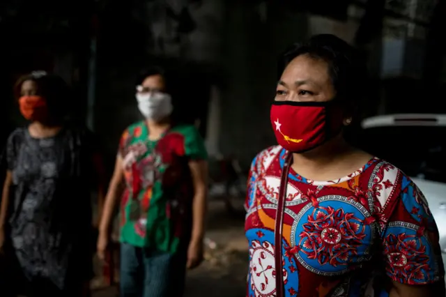 A woman wears a face mask, Yangon