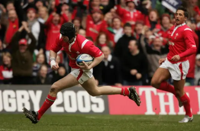 Ryan Jones runs in a fine Wales try against Scotland