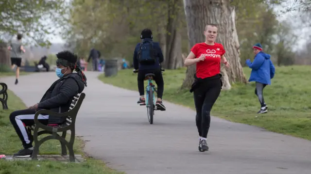 Runners and cyclist in Brockwell Park, London last week